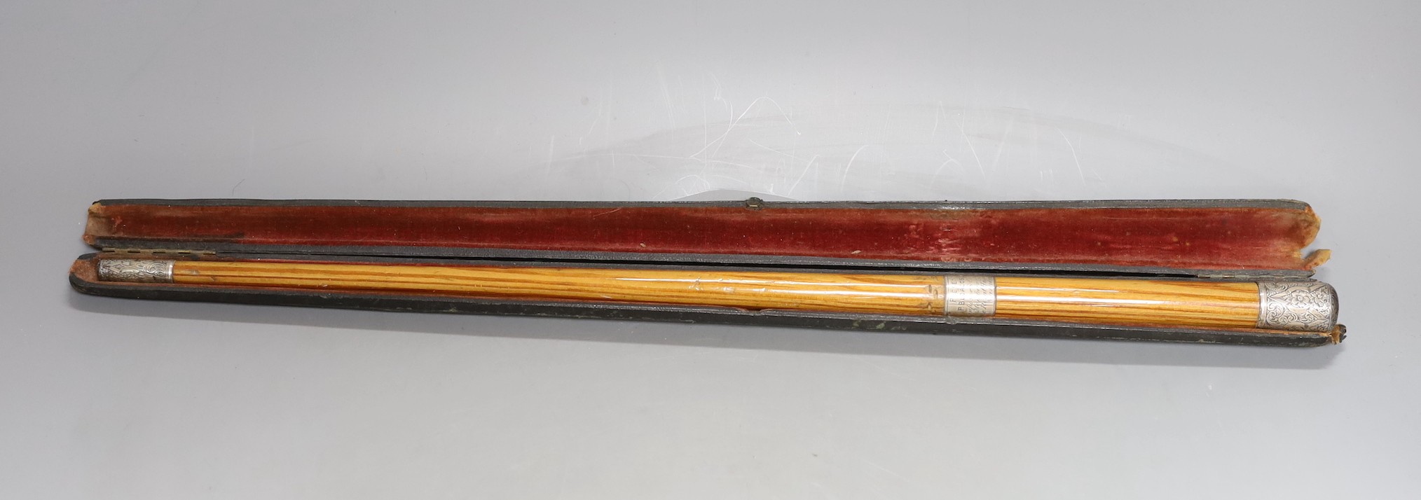 A cased presentation conductors baton, baton 51.5 cms long.